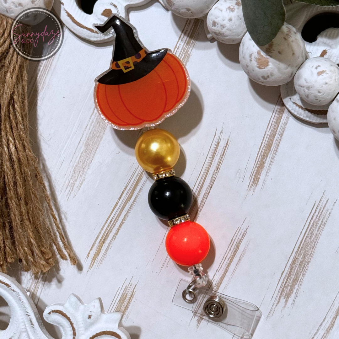 Pumpkin with Witch Hat Badge Reel