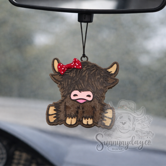 Sitting Highland Cow